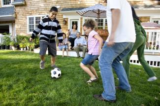 family playing football